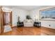 Inviting living room boasts hardwood floors, natural light, and neutral tones at 10983 W Exposition Pl, Lakewood, CO 80226