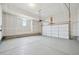 Spacious unfinished garage with concrete floors and ample room for storage and parking at 21091 E 63Rd Dr, Aurora, CO 80019
