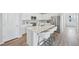 Modern kitchen featuring a large island with bar seating and stainless steel appliances at 21091 E 63Rd Dr, Aurora, CO 80019