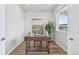 Bright home office boasts a modern desk, ample natural light, and sleek wood flooring at 21091 E 63Rd Dr, Aurora, CO 80019
