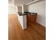 Basement bar featuring granite countertop and wooden cabinets at 5241 S Shawnee St, Aurora, CO 80015