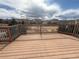 Exterior shot of wooden backyard deck showing the railing at 5241 S Shawnee St, Aurora, CO 80015