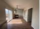 Inviting living room space featuring a fireplace, hardwood floors, and deck access at 5241 S Shawnee St, Aurora, CO 80015