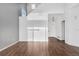 Open living room showcasing hardwood floors, neutral paint, and a view of the entrance at 5241 S Shawnee St, Aurora, CO 80015