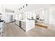 Bright, open-concept kitchen featuring a large center island and stainless steel appliances at 3022 Fenton St, Wheat Ridge, CO 80214