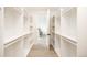 Spacious walk-in closet featuring custom shelving and racks, leading into an adjacent bedroom at 3022 Fenton St, Wheat Ridge, CO 80214