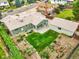 Aerial view of a single-Gathering home, detached garage, and landscaped backyard at 6811 S Clermont Dr, Centennial, CO 80122