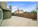 Concrete back patio with a full privacy fence and access to back alleyway at 6811 S Clermont Dr, Centennial, CO 80122