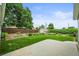 Well-maintained lawn, garden area, and a partial view of the patio at 6811 S Clermont Dr, Centennial, CO 80122