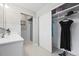 This bathroom has marble tile, a glass door shower, and a large closet at 6811 S Clermont Dr, Centennial, CO 80122