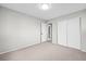 This bedroom is newly painted, has carpet, and closet at 6811 S Clermont Dr, Centennial, CO 80122
