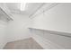 Walk-in closet featuring built in shelving and metal racks for optimal storage at 6811 S Clermont Dr, Centennial, CO 80122