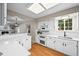 Lovely kitchen with hardwood floors, modern appliances and quartz countertops at 6811 S Clermont Dr, Centennial, CO 80122