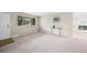 This living room is bathed in natural light and features a charming fireplace at 6811 S Clermont Dr, Centennial, CO 80122