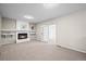 Cozy living room features a fireplace and sliding glass doors to sunroom at 6811 S Clermont Dr, Centennial, CO 80122