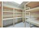 Unfinished storage space featuring natural wood shelving at 6811 S Clermont Dr, Centennial, CO 80122