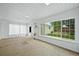 Sunroom featuring a large window, skylight and views of the backyard at 6811 S Clermont Dr, Centennial, CO 80122