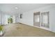Sunroom featuring a textured floor, skylight and views of the backyard at 6811 S Clermont Dr, Centennial, CO 80122