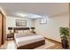 Cozy basement bedroom with wood floors, neutral decor, and ample storage space at 10365 E Weaver Cir, Englewood, CO 80111