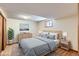Cozy bedroom featuring a comfortable bed, ample natural light, and closet at 10365 E Weaver Cir, Englewood, CO 80111