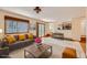 Open-concept living area with a view of the kitchen and access to the outdoors at 10365 E Weaver Cir, Englewood, CO 80111