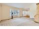 A bright and spacious living room features large windows, a bay window and neutral paint at 10365 E Weaver Cir, Englewood, CO 80111