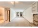 Expansive living room with fireplace, large mirror closet doors and abundant natural light at 10365 E Weaver Cir, Englewood, CO 80111