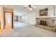 Spacious bedroom with brick fireplace and built-in shelving for decor, creating a cozy and stylish retreat at 10365 E Weaver Cir, Englewood, CO 80111