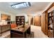Inviting home office with custom shelving, a large desk, and ample storage space at 10365 E Weaver Cir, Englewood, CO 80111