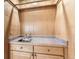 Functional wet bar area featuring a sink, countertop, and cabinetry for storage at 10365 E Weaver Cir, Englewood, CO 80111