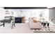 Open basement featuring living area, wet bar, and modern finishes at 1880 S Adams St, Denver, CO 80210