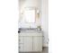 Bright bathroom featuring updated vanity with grey counter and modern fixtures at 1880 S Adams St, Denver, CO 80210