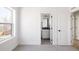 Bedroom with adjacent bathroom and window with natural light at 1880 S Adams St, Denver, CO 80210