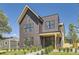 Modern two-story home features striking brick, black trim, and a well-manicured front yard at 1880 S Adams St, Denver, CO 80210