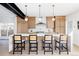 Bright kitchen with bar seating, stainless steel appliances and pendant lighting at 1880 S Adams St, Denver, CO 80210