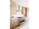 Beautiful kitchen with stainless steel range, neutral cabinetry, and white countertops at 1880 S Adams St, Denver, CO 80210