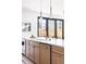 Kitchen with white marble countertops, custom cabinetry and stainless steel appliances at 1880 S Adams St, Denver, CO 80210