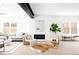 Cozy living room with modern fireplace and neutral-toned furniture at 1880 S Adams St, Denver, CO 80210