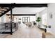 Open-concept living room with modern furnishings, natural light, and a staircase at 1880 S Adams St, Denver, CO 80210