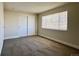 Well-lit bedroom featuring carpet and a window at 13030 E Kansas Pl, Aurora, CO 80012