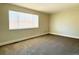 Bright bedroom with carpet flooring and large window at 13030 E Kansas Pl, Aurora, CO 80012