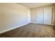 Spacious bedroom with double door closet and carpet at 13030 E Kansas Pl, Aurora, CO 80012