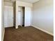 Bedroom with double door closet and carpet flooring at 13030 E Kansas Pl, Aurora, CO 80012