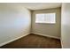 Simple bedroom with carpet, window and neutral walls at 13030 E Kansas Pl, Aurora, CO 80012