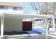 Covered carport with adjacent storage at 13030 E Kansas Pl, Aurora, CO 80012