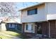 Two-story brick townhouse with a yard and trees at 13030 E Kansas Pl, Aurora, CO 80012