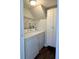 Laundry room with washer, dryer, and shelving at 13030 E Kansas Pl, Aurora, CO 80012