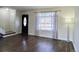 Bright living room with hardwood floors and a view of the entryway at 13030 E Kansas Pl, Aurora, CO 80012