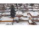 Aerial view of home in winter showcasing fenced yard, patio area, detached shed and snow-covered roof at 6048 Xenon St, Arvada, CO 80004