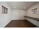 Minimalist office featuring warm wood floors and one built in counterspace at 6048 Xenon St, Arvada, CO 80004